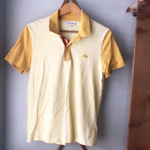 Yellow Lacoste Shirt with Rainbow Collar.